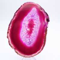 Polerad skiva av färgad rosa agat