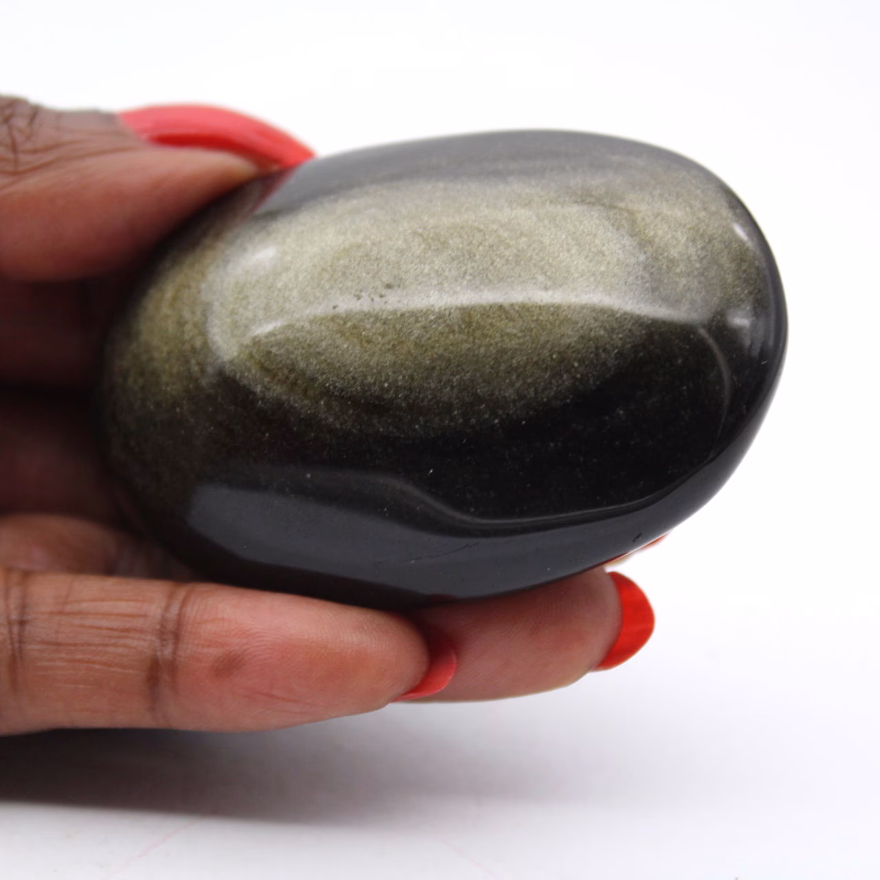 Polerad sten av gyllene mexikansk obsidian, format på 80 g